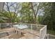 Enjoy outdoor dining on your spacious deck surrounded by lush greenery at 1005 W Lenoir St, Raleigh, NC 27603