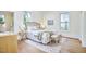 Cozy bedroom features a plush bed, wood floors, and bright windows at 1005 W Lenoir St, Raleigh, NC 27603