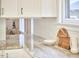 Granite countertops with white cabinetry and a decorative backsplash are highlighted in this kitchen space at 1005 W Lenoir St, Raleigh, NC 27603