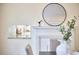 Close up of the dining room fireplace and a peek of the kitchen at 1005 W Lenoir St, Raleigh, NC 27603