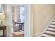 Dining area with a view of the stairs and dining room table and chairs at 1005 W Lenoir St, Raleigh, NC 27603