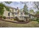 Charming two-story home with a spacious backyard, beautiful landscaping, and a lovely outdoor deck at 1005 W Lenoir St, Raleigh, NC 27603