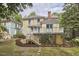Charming two-story home with a spacious backyard, beautiful landscaping, and a lovely outdoor deck at 1005 W Lenoir St, Raleigh, NC 27603