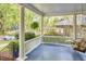Inviting front porch with classic white railings, blue flooring, and comfortable seating for relaxing outdoors at 1005 W Lenoir St, Raleigh, NC 27603