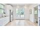 Sunlit kitchen with stainless steel appliances and access to backyard deck at 1005 W Lenoir St, Raleigh, NC 27603