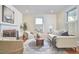 Cozy living room featuring a fireplace, comfortable seating, and elegant decor at 1005 W Lenoir St, Raleigh, NC 27603