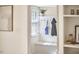 A mud room featuring white shelving and cabinetry and hardwood floors at 1005 W Lenoir St, Raleigh, NC 27603
