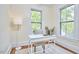 Cozy home office with natural light, hardwood floors, and a comfortable workspace for productivity at 1005 W Lenoir St, Raleigh, NC 27603
