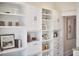 A pantry featuring stylish white shelving and cabinetry and hardwood floors at 1005 W Lenoir St, Raleigh, NC 27603