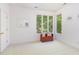 Sun-filled bedroom featuring a window seat and peaceful outdoor views at 1011 Wood Sage Dr, Chapel Hill, NC 27516