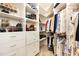 Well-organized walk-in closet with ample storage, including shelves, drawers, and hanging space for clothing and shoes at 1011 Wood Sage Dr, Chapel Hill, NC 27516