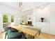 Bright dining room with hardwood floors, modern decor, and French doors at 1011 Wood Sage Dr, Chapel Hill, NC 27516