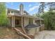 Striking home with a chimney and attached two car garage at dusk at 1011 Wood Sage Dr, Chapel Hill, NC 27516