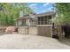 Inviting house with a screened porch and an attached two car garage at 1011 Wood Sage Dr, Chapel Hill, NC 27516