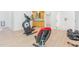 This home gym boasts exercise equipment and access to storage and the outdoors at 1011 Wood Sage Dr, Chapel Hill, NC 27516