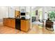 Open kitchen with modern appliances, ample counter space, and hardwood floors at 1011 Wood Sage Dr, Chapel Hill, NC 27516