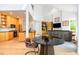 Spacious living room with wood floors, modern furnishings, an open floor plan and lots of natural light at 1011 Wood Sage Dr, Chapel Hill, NC 27516