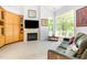 Living room with large windows, modern furnishings, and a fireplace creates an inviting atmosphere at 1011 Wood Sage Dr, Chapel Hill, NC 27516