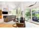 Living room with vaulted ceilings, a marble table, modern furnishings and views of the backyard at 1011 Wood Sage Dr, Chapel Hill, NC 27516
