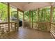 Enclosed porch with view of grill and greenery at 1011 Wood Sage Dr, Chapel Hill, NC 27516