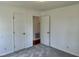 Cozy bedroom features two closets for ample storage and natural light at 1031 Jackson Royster Rd, Henderson, NC 27537