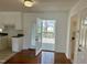 Bright kitchen featuring white cabinets and stainless steel appliances at 1031 Jackson Royster Rd, Henderson, NC 27537