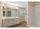 Bathroom featuring dual sinks, vanity, and a large mirror at 104 Dilworth Ct, Cary, NC 27513