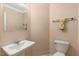 Cozy half bathroom with a pedestal sink and neutral decor at 104 Dilworth Ct, Cary, NC 27513