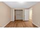 Bedroom and adjacent closet with shelving, plus a glimpse of the next room at 104 Dilworth Ct, Cary, NC 27513