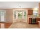 Bright dining area with a bay window and modern light fixture at 104 Dilworth Ct, Cary, NC 27513