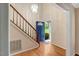 Inviting foyer with hardwood floors and a staircase leading upstairs at 104 Dilworth Ct, Cary, NC 27513