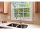 Modern kitchen features a stainless steel faucet and large window at 104 Dilworth Ct, Cary, NC 27513