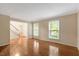 Large living room with hardwood floors and bright natural light at 104 Dilworth Ct, Cary, NC 27513