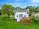 Backyard view of a two-story home with a large deck and spacious yard at 104 Dilworth Ct, Cary, NC 27513