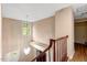 A staircase with wood railings ascends to the upper level at 104 Dilworth Ct, Cary, NC 27513