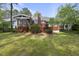 Expansive backyard with a well-maintained lawn and a deck area perfect for outdoor entertaining at 109 Deer Valley Dr, Cary, NC 27519