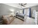 Cozy bedroom featuring neutral color palette, a sitting chair and soft carpet providing comfort and warmth at 109 Deer Valley Dr, Cary, NC 27519
