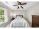 Comfortable bedroom with natural light, neutral tones, and wooden furniture creating a soothing atmosphere at 109 Deer Valley Dr, Cary, NC 27519