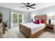 Inviting bedroom with a wooden frame bed, study space and natural light creating a cozy retreat at 109 Deer Valley Dr, Cary, NC 27519