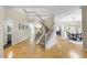 Grand foyer with a staircase, hardwood floors, and elegant decor, creating a welcoming entrance at 109 Deer Valley Dr, Cary, NC 27519