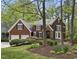 Charming two-story home with a well-manicured lawn, mature trees, and a two-car garage at 109 Deer Valley Dr, Cary, NC 27519