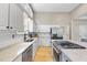 Bright kitchen with white cabinets, stainless steel appliances, and granite countertops at 109 Deer Valley Dr, Cary, NC 27519
