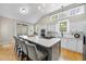 Spacious kitchen featuring a large island with seating and stainless steel appliances at 109 Deer Valley Dr, Cary, NC 27519