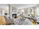 Cozy living room with a fireplace, hardwood floors, and stylish furnishings for relaxed living at 109 Deer Valley Dr, Cary, NC 27519