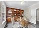 Office featuring custom wood built-ins and large windows at 109 Deer Valley Dr, Cary, NC 27519