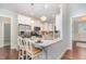 Stylish kitchen with breakfast bar and stainless steel appliances at 1101 Sky Wave Trl, Raleigh, NC 27603