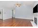 Spacious living room featuring hardwood floors and a cozy fireplace at 1101 Sky Wave Trl, Raleigh, NC 27603
