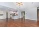 Open concept living area with hardwood floors connecting to kitchen at 1101 Sky Wave Trl, Raleigh, NC 27603