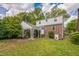Brick home with backyard covered patio and a green lawn at 1105 Englewood Ave, Durham, NC 27701
