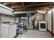 Spacious basement laundry room with washer, dryer, and utility systems at 1105 Englewood Ave, Durham, NC 27701